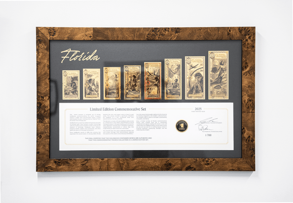 A framed Goldback denomination set showing the fractional range from small to large